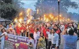  ?? HT FILE ?? A file photo of trade union members taking out a torch rally in Bhopal. Left and Congress-affiliated workers’ unions will go ahead with their day-long stir, demanding a minimum wage of `18,000 for every worker.