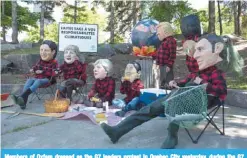  ?? —AFP ?? Members of Oxfam dressed as the G7 leaders protest in Quebec City yesterday, during the G7 Summit.