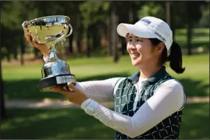  ?? Submitted photo ?? SHOOTOUT WINNER: Hyemin Kim, of Seoul, South Korea, presents her trophy Sunday won at the 2018 Murphy USA El Dorado Shootout at the Mystic Creek Golf Course in El Dorado. Photo courtesy of the Symetra Tour.