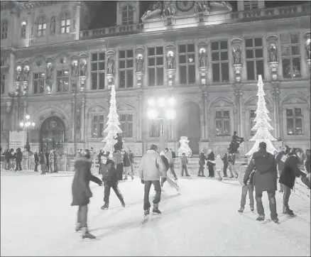  ?? Photos: Curt Woodhall/postmedia News Group ?? Outdoor skating — either on the first floor of the Eiffel Tower or at the Place de la Trocadero Christmas Market — is popular.