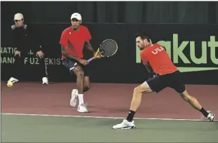  ?? AP PHOTO ?? AUSTIN KRAJICEK (RIGHT) AND RAJEEV RAM OF THE USA in action against Sergey Fomin and Sanjar Fayziev of Uzbekistan during a doubles Davis Cup qualifier match between Uzbekistan and the USA in Tashkent, Uzbekistan, on Saturday.