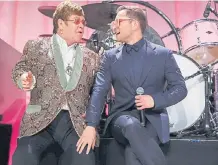  ??  ?? Elton John (izquierda) estuvo detrás de la producción de la cinta.