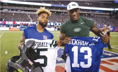  ??  ?? Ex- Bears receiver Brandon Marshall ( right), who signed a two- year deal Wednesday with the Giants, will be paired with Odell Beckham. | AP