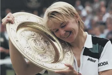  ??  ?? 0 Jana Novotna celebrates after winning Wimbledon, her only grand slam title, in July 1998.