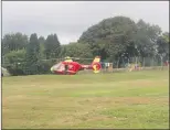  ??  ?? An air ambulance lands at Ipstones Recreation Ground.