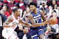  ?? (AP) ?? In this Jan 11, 2020 file photo, Minnesota Timberwolv­es forward Jordan Bell (7) looks to drive around Houston Rockets guard Michael Frazier (left), during the second half of an NBA basketball
game in Houston.