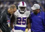  ?? John Minchillo The Associated Press ?? Buffalo Bills running back LeSean McCoy is assisted off the field after being injured against the Colts in Indianapol­is on Oct. 21.