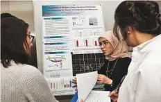  ?? Courtesy: Qatar University ?? A student briefs judges about her research project.