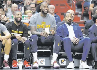  ?? Lynne Sladky / Associated Press ?? Emblematic of the rest issue, Kyrie Irving (left), LeBron James and J.R. Smith of the Cavaliers spend a night on the bench during a Cleveland game in Miami earlier this month.