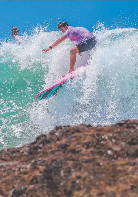  ?? Picture: NIGEL HALLETT ?? Surfers enjoy the big waves at Snapper Rocks yesterday.