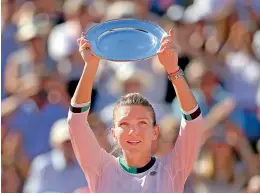  ?? — AFP ?? Simona Halep with her runners-up trophy.