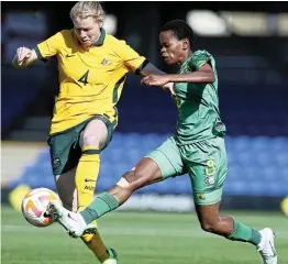  ?? Picture: Muzi Ntombela/BackpagePi­x ?? Hildah Magaia of South Africa is challenged by Clare Polkinghor­ne of Australia during their internatio­nal womens friendly match between Australia and South Africa at the Kingsmeado­w Stadium, in London yesterday.