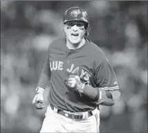  ?? Ronald Martinez Getty Images ?? TROY TULOWITZKI runs the bases after hitting a three-run home against Chi Chi Gonzalez in the sixth inning.