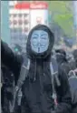  ?? REUTERS ?? An anti-government protester ■ wearing a Guy Fawkes mask attends a protest in Hong Kong.