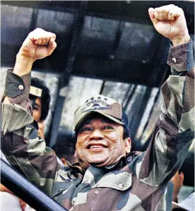  ??  ?? Noriega at a rally in 1988 and (below) in 1990 after his conviction on charges of drug traffickin­g and racketeeri­ng