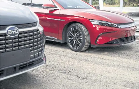  ?? REUTERS ?? BYD’s Tang EV and Han EV are seen in November.
