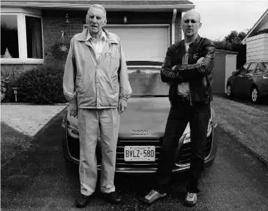  ?? Davi d Booth/ Driving ?? David Booth, right, and his father John Booth stand in front of a 2015 Audi R8 Spyder V10.