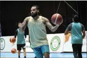 ?? HADI MIZBAN — THE ASSOCIATED PRESS ?? Isaac Banks, an American basketball player with the Hashed al-Shaabi — the Popular Mobilizati­on Forces — in the Iraqi Basketball Super League, takes part in a team practice in Baghdad, Iraq, on March 21.