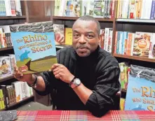  ?? TIBRINA HOBSON/WIREIMAGE ?? LeVar Burton, at a 2014 signing for his children’s book “The Rhino who Swallowed a Storm,” is known for hosting “Reading Rainbow” and his roles on the TV series “Star Trek: The Next Generation” and the miniseries “Roots.”