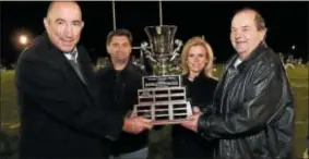  ?? JOHN BLAINE — FOR THE TRENTONIAN ?? Longtime Trentonian sports writer George O’Gorman, right, presents the first annual George O’Gorman Trophy to Steinert principal Nate Webber, left, at halftime of a Friday night football game between Steinert and Nottingham.