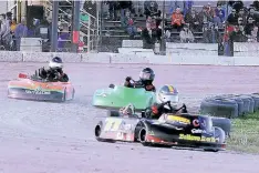  ?? BERND FRANKE/ POSTMEDIA NEWS ?? Some of smallest drivers at Merrittvil­le Speedway racing on the big track during karting demonstrat­ion. The karting season officially wrapped up with an awards banquet.