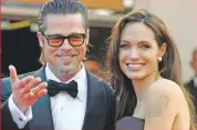  ??  ?? Angelina Jolie und Brad Pitt haben beide Paar-Tattoos unter der Haut.