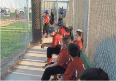  ??  ?? Kaylee Pineda plays baseball in Westmorlan­d, Calif. Her mother, Eva, fears more kids are going to have asthma problems.