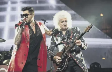  ??  ?? 0 Queen’s Brian May with Adam Lambert, capable of handling anything from a bawl to a tender croon