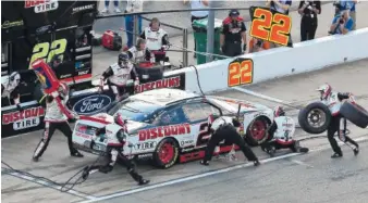  ?? AP PHOTO/PAUL ABELL ?? Joey Logano makes a pit stop during the NASCAR Xfinity Series race at Atlanta Motor Speedway in Hampton, Ga., in February.