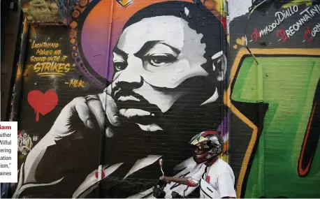  ??  ?? In memoriam
A mural of Martin Luther King in Boston. “Wilful blindness to black suffering is a key manifestat­ion of anti-black racism,” says Kevin Gaines