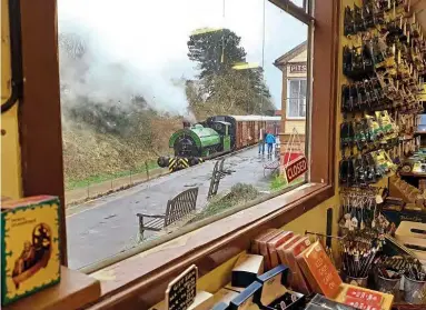  ??  ?? Pictured during the wet and windy weather from Storm Ciara on February 9, No. 15 Eustace Forth is seen at Pitsford and Brampton through the window of the station’s well-stocked shop. NICOLA FOX