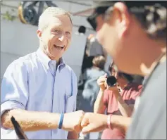  ??  ?? File photo shows Steyer greets an attendee during a rally and press conference at San Francisco City Hall in San Francisco, California. — AFP photo