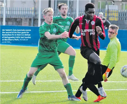  ?? ALAN FINN PICTURE BY ?? ON TARGET: Fola Ayorinde scores the second of his four goals for Benbulben FC in their 6-2 defeat of Ballygawle­y Celtic last Sunday at MacSharry Park.