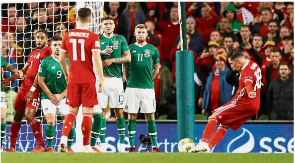  ?? — Reuters ?? On point: Wales’ Harry Wilson scoring their first goal from a free-kick during their Nations League match against Ireland on Tuesday.