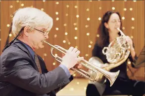  ?? Toni Dolce / Contribute­d photo ?? Don Batchelder, left, who plays trumpet in the Stamford Symphony Brass Quintet, is seen here with quintet member Eva Conti, on the French horn. The symphony is partnering with the Westport Library.