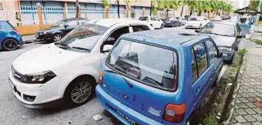  ??  ?? An infamous woe of Malaysian road users is the seemingly acceptable practice of double parking, sometimes even triple parking.