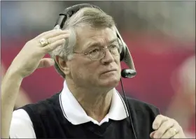  ?? RIC FELD - THE ASSOCIATED PRESS ?? FILE - Atlanta Falcons coach Dan Reeves adjusts his headset at the start of play against the Detroit Lions at the Georgia Dome in Atlanta Sunday, Dec. 22, 2002.