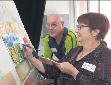  ?? Picture: PAUL CARRACHER ?? RELAXING: Artist tutor Grant Thomas helps Cheryl Wakeham during a Ararat Disability Carers Craft Connection session at Ararat Gallery TAMA.