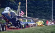  ??  ?? Millington’s Blue Angel, which has greeted visitors to the Navy Base since 1975, returns to its home at the Millington airport via Covington Pike after the completion of a paint and restoratio­n project.