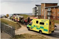  ??  ?? Fire service and ambulance vehicles at the scene and below, a raft used for the rescue.