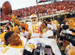  ?? THE ASSOCIATED PRESS ?? Tennessee receiver Jauan Jennings (15) is carried off by teammates Kyle Phillips (5) and Charles Mosley (78) after last season’s 34-31 win at Georgia that was won with Jennings catching a 43-yard “Hail Mary” as time expired.