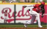  ?? CAROLYN KASTER / ASSOCIATED PRESS ?? Whatever happens with the Reds this season, shortstop Elly De La Cruz should be worth at least half the price of a Great American Ball Park ticket, Hal Mccoy says.