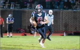  ?? AUSTIN HERTZOG — DIGITAL FIRST MEDIA ?? Boyertown quarterbac­k Ayden Mathias scans the field during a game earlier this season. Mathias hit receiver Jerry Kapp for a game-winning Hail Mary touchdown during Friday night’s victory over Norristown.