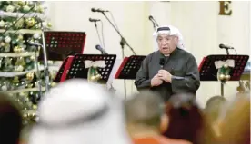  ??  ?? KUWAIT: Emmanuel Gharib, Chairman of the National Evangelica­l Church Kuwait and Pastor of the Kuwait Presbyteri­an Church, leads a Christmas mass at a church in Kuwait City on December 24, 2016. — Photo by Yasser Al-Zayyat