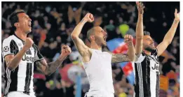  ??  ?? TURIN PROUD Mario Mandzukic, left, leads the Juve celebratio­ns at full-time