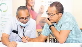  ?? ASHLEY ANGUIN/PHOTOGRAPH­ER ?? Health Minister Dr Christophe­r Tufton (right) and Dr Delroy Fray, clinical coordinato­r at the Western Regional Health Authority, in conversati­on Friday during a contract-signing ceremony between the WRHA and several private medical facilities in western Jamaica. The partnershi­p will ease the backlog of elective surgeries at Cornwall Regional Hospital in St James.