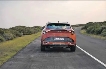  ?? ?? Step up: A striking feature of the new
Kia Sportage Gt-line is the front grille, which makes the car look bigger than it is. The rear sports a little boot-lip ‘spoiler’ and the interior boast a massive infotainme­nt centre.