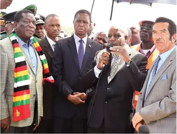  ?? Joseph Nyadzayo — Picture: Presidenti­al Photograph­er ?? President Mnangagwa, his Zambian counterpar­t President Edgar Lungu (centre), host President Ian Khama and other dignitarie­s inspect the Kazungula Bridge in Kasake, Botswana yesterday.