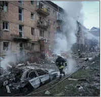  ?? (AP/Efrem Lukatsky) ?? Ukrainian firefighte­rs work at the scene of a Russian strike Wednesday in Vyshgorod outside Kyiv. Authoritie­s said multiple areas of Ukraine were left without electricit­y after a flurry of strikes. More photos at arkansason­line.com/ukrainemon­th9/.