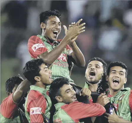  ?? Picture: Getty ?? Bangladesh’s Mustafizur Rahman is lifted by his team-mates after victory in the second ODI against India